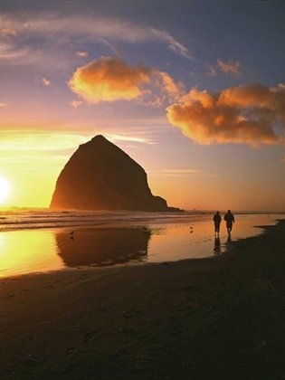 Picture of OR, CANNON BEACH COUPLE BY HAYSTACK ROCK, SUNSET