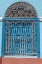 Picture of ORNATE WROUGHT IRON COVERING ON BLUE WOODEN WINDOW SHUTTERS-TRINIDAD-CUBA