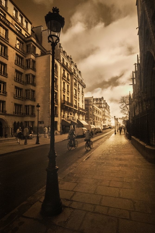 Picture of BICYCLE RIDERS BESIDE NOTRE DAME CATHEDRAL AND HER GARGOYLES IN PARIS-FRANCE