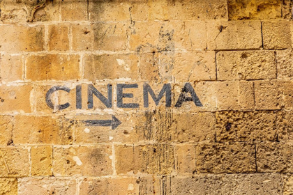 Picture of ITALY-BASILICATA-PROVINCE OF MATERA-MATERA SIGN ON A WALL POINTING TO A CINEMA-MOVIE THEATER