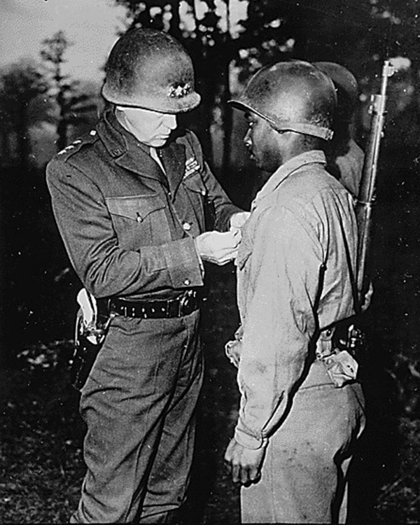 Picture of WWII LT. GEN. GEORGE S. PATTON-U.S. THIRD ARMY COMMANDER-PINS THE SILVER STAR ON PRIVATE ERNEST A. J