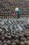 Picture of MAN IN THE MIDDLE OF BIG PILE OF WINE JARS-WUXI-JIANGSU PROVINCE-CHINA