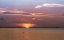 Picture of THE SUN RISING BEHIND THE SKYWAY BRIDGE STUNNING PURPLE SKY AND REFLECTION ON THE GULF OF MEXICO