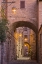 Picture of ITALY- UMBRIA- ASSISI. ALLEYWAY WITH ARCHES AND LANTERNS IN THE EVENING.