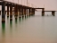 Picture of OLD PIER ON THE BEACH AND LONG EXPOSURE SEA WAVES