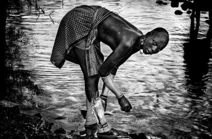 Picture of SURMA TRIBE WOMAN WASHING UP HER JEWELRY - ETHIOPIA