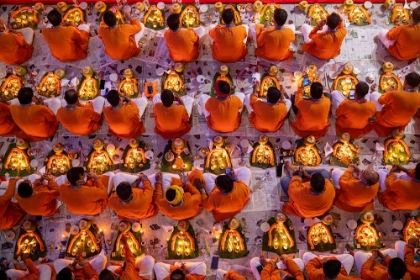 Picture of DEVOTEES PRAY WITH LIGHT