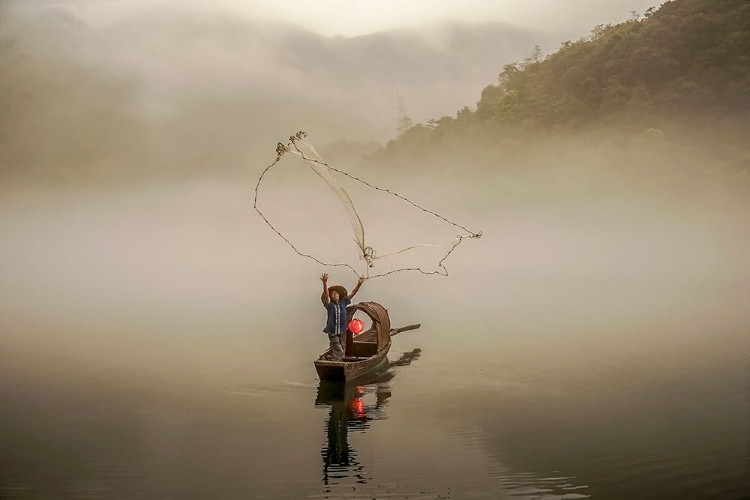 Picture of A FISHERMAN IN THE MORNING MIST