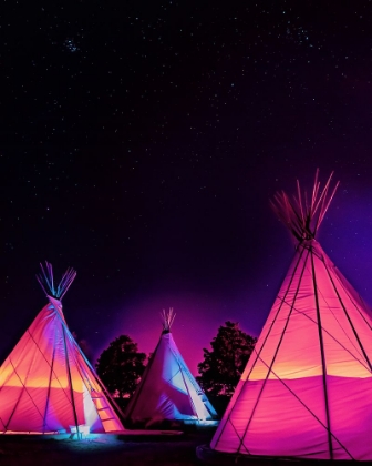 Picture of VAPORWAVE TEEPEES GLOWING AT NIGHT UNDER STARS IN MARFA TEXAS