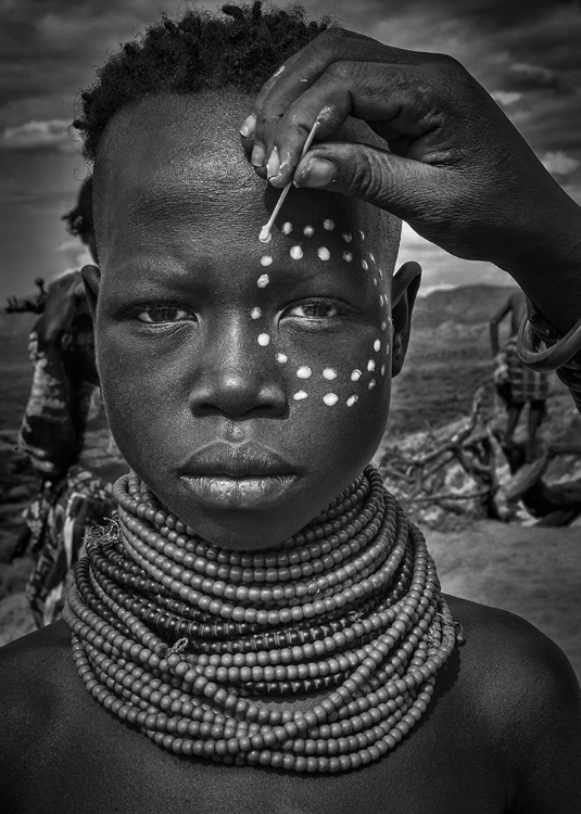 Picture of PAINTING THE FACE OF A KARO TRIBE GIRL (OMO VALLEY-ETHIOPIA)