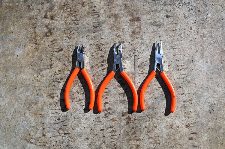 Picture of THREE ORANGE HANDLED PLIERS